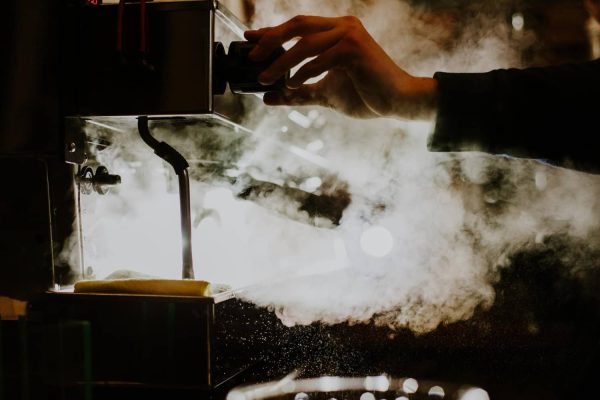 closeup-image-female-barista-using-coffeemaking-machine-steam-milk-cafe (1)